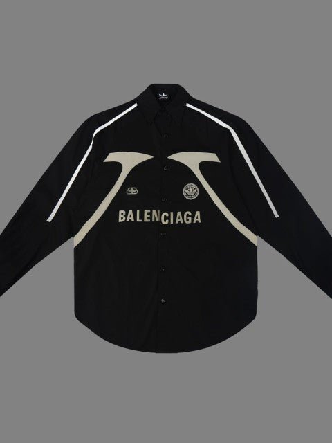 Black oversized button-down shirt with white shoulder piping, cream curved panels and BALENCIAGA lettering on chest