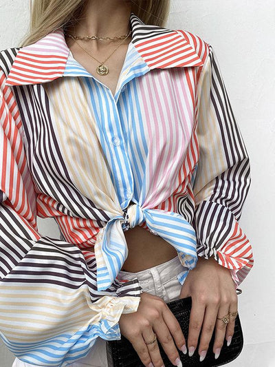 Colorful striped blouse with lapel collar, front knot at waist, and voluminous lantern sleeves.