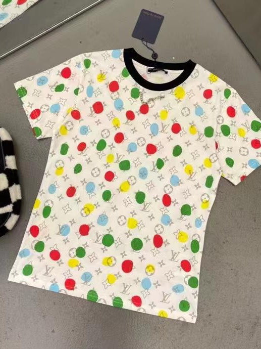 White cotton Lycra T-shirt with multicolor circle prints, black crew neck, short sleeves, tag attached.