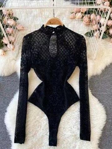 Black high-neck lace mesh bodysuit with long sleeves and sculpted waist, displayed on a hanger.