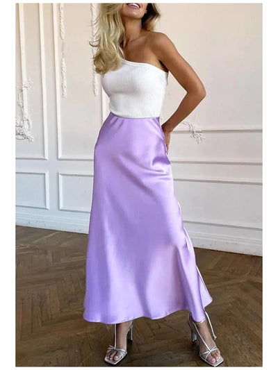 Lavender satin A-line long skirt, ankle-length with a smooth drape, shown with a strapless white top and silver strappy heels.