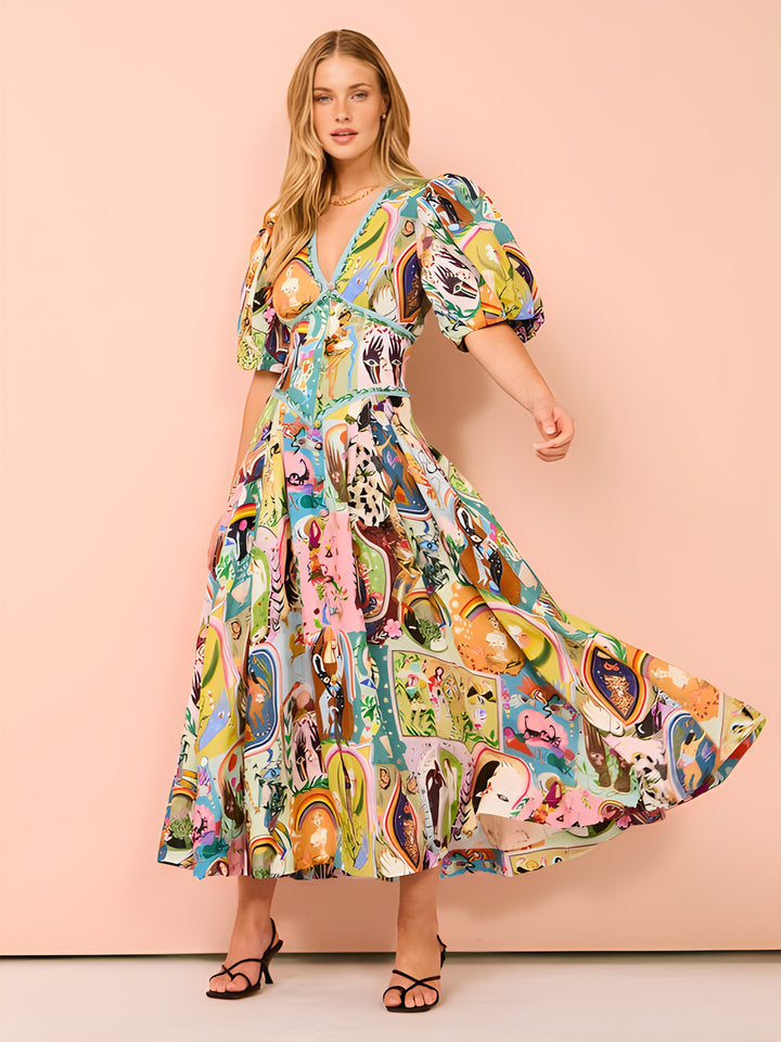 Model in a colorful linen-look maxi dress with a V-neck, short puff sleeves, and a flowy A-line skirt, peach backdrop.