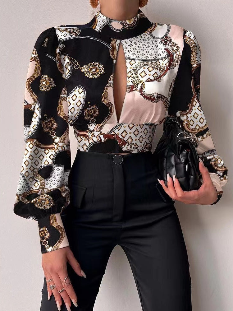 Shiny satin crop top with black, pink, ivory floral-baroque print, long puff sleeves, high neckline and front keyhole